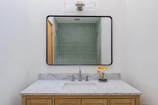 a bathroom with a sink and a mirror