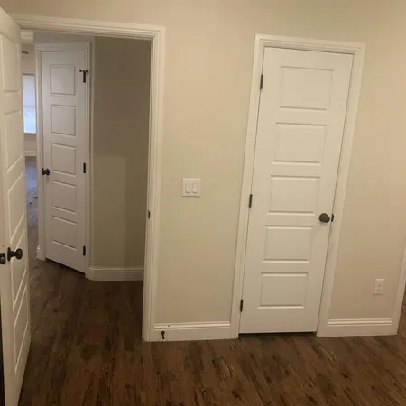 an empty room with wooden floor
