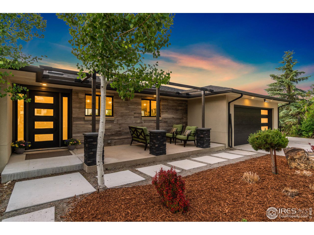 8861 Marathon Road Niwot, CO 80503 - Photo 2 of 40 a house view with a sitting space and garden