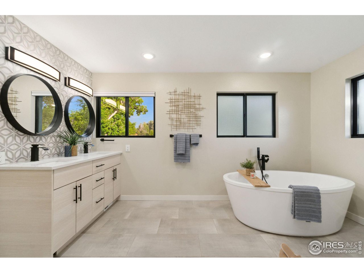 8861 Marathon Road Niwot, CO 80503 - Photo 21 of 40 a bathroom with a double vanity sink and a mirror