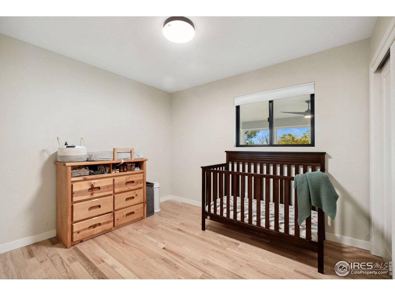 8861 Marathon Road Niwot, CO 80503 - Photo 25 of 40 a bedroom with furniture and a window
