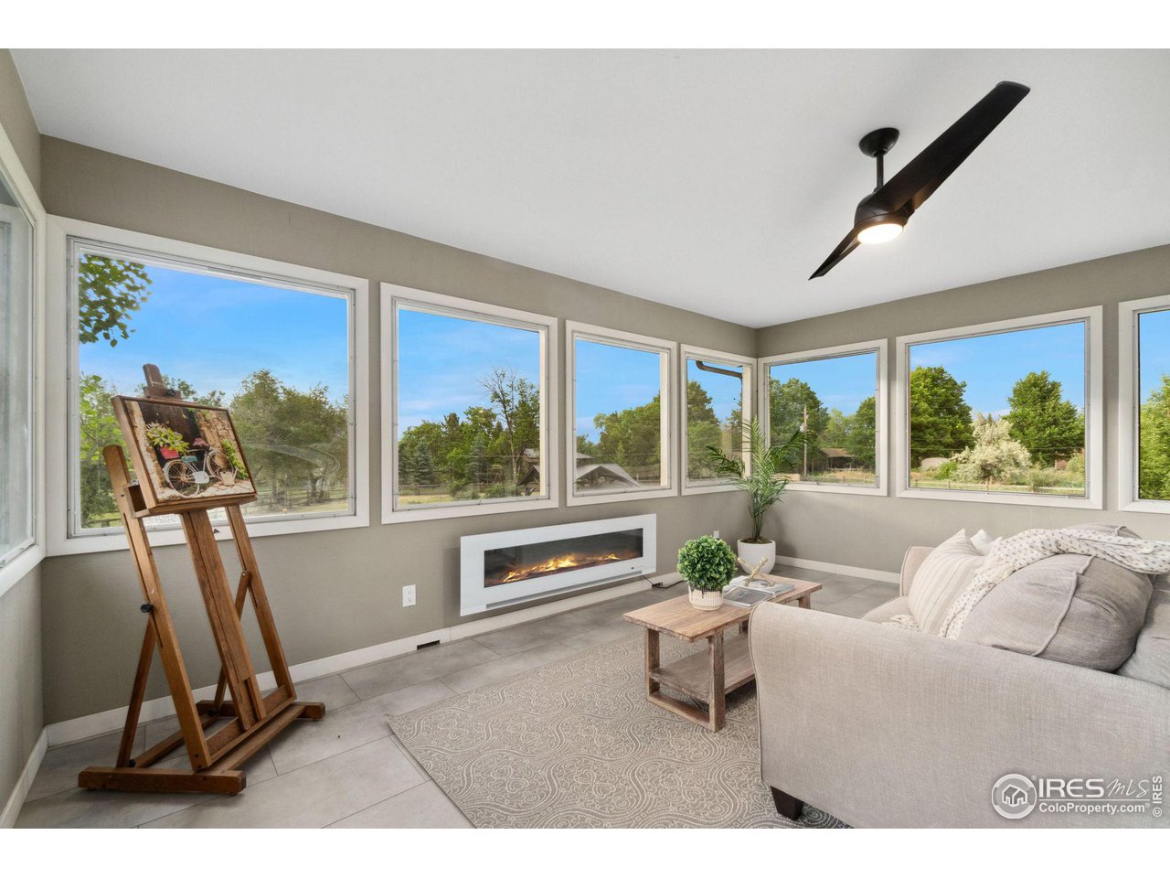 8861 Marathon Road Niwot, CO 80503 - Photo 26 of 40 a living room with furniture tv and a large window