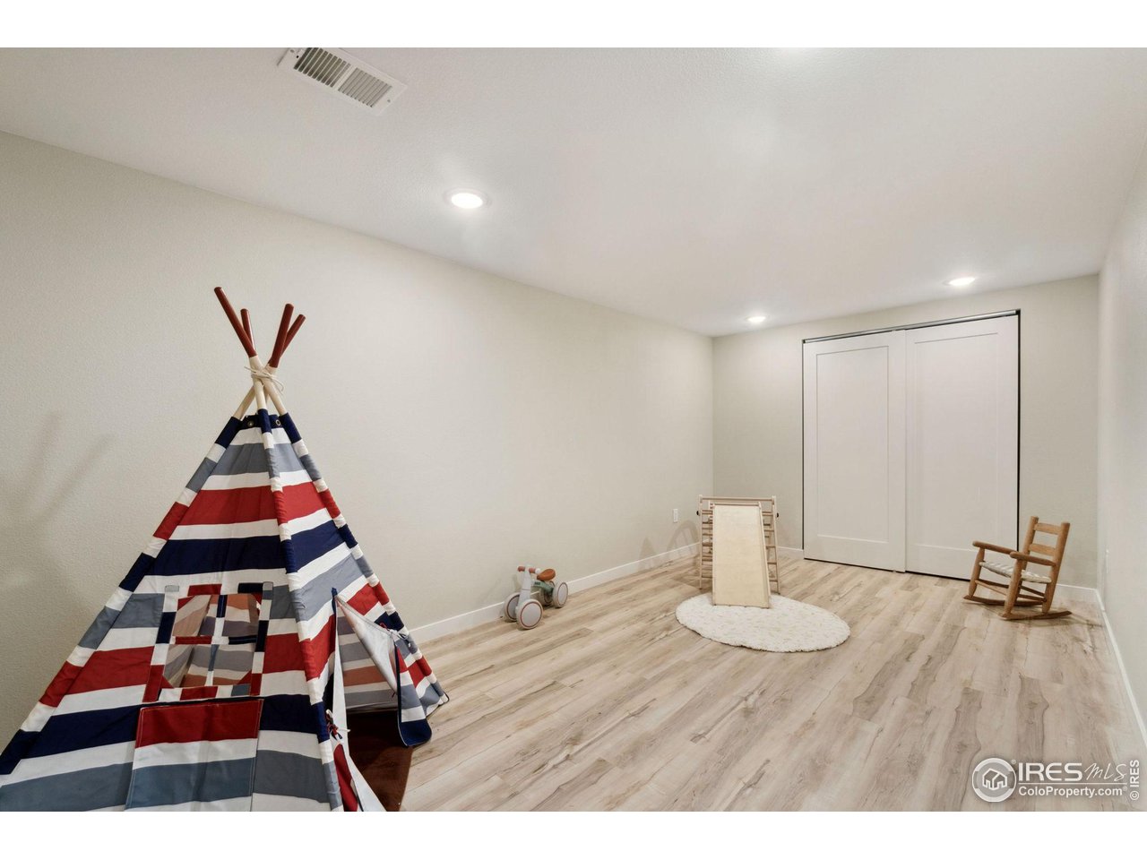 8861 Marathon Road Niwot, CO 80503 - Photo 33 of 40 a room with gym equipment and wooden floor