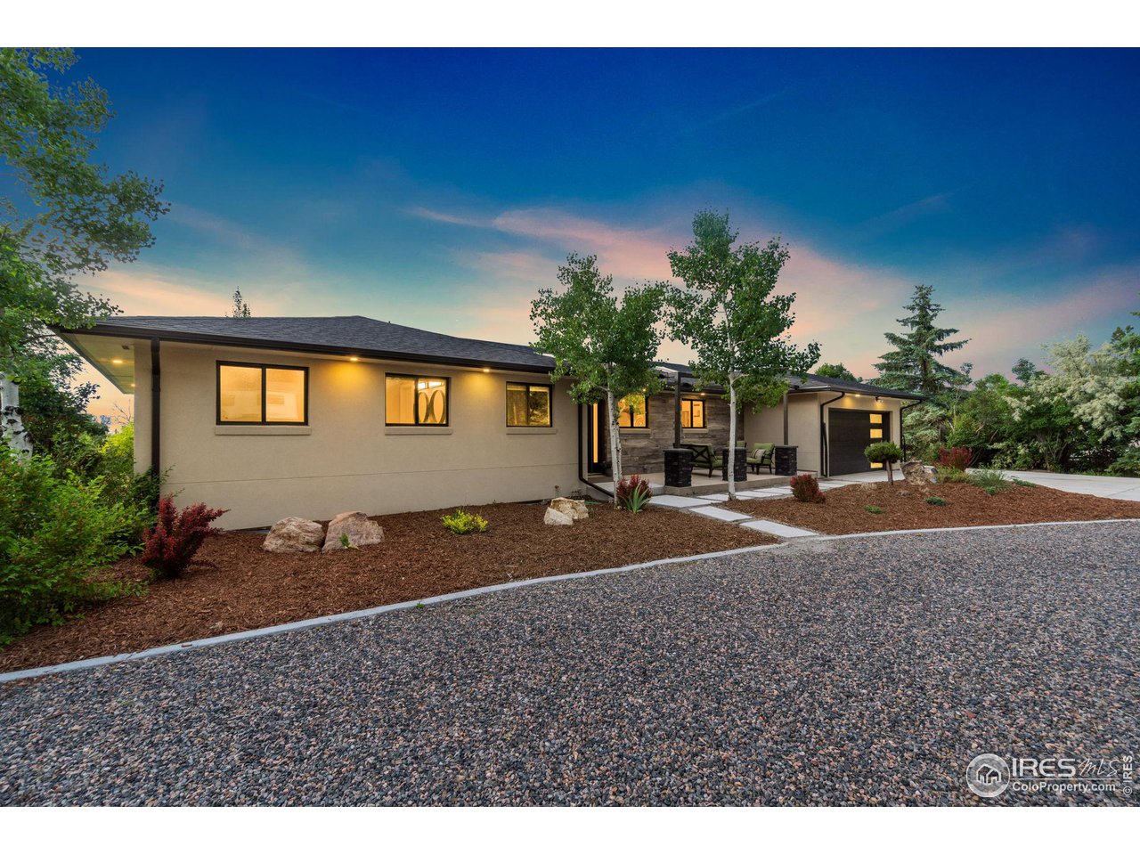 8861 Marathon Road Niwot, CO 80503 - Photo 4 of 40 a front view of a house with a yard