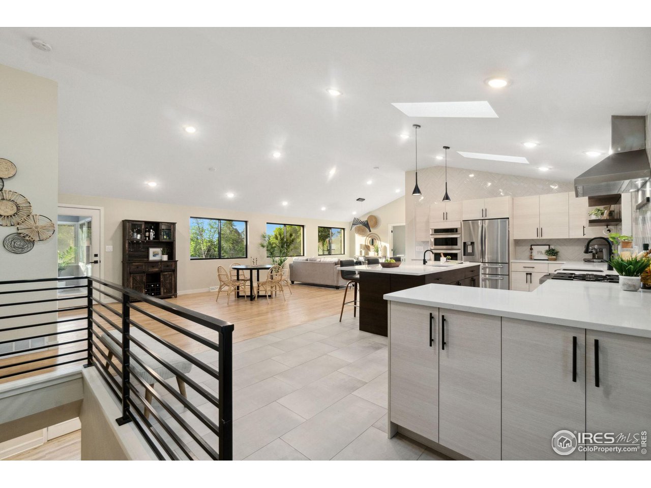8861 Marathon Road Niwot, CO 80503 - Photo 7 of 40 a living room with stainless steel appliances kitchen island a sink table and chairs