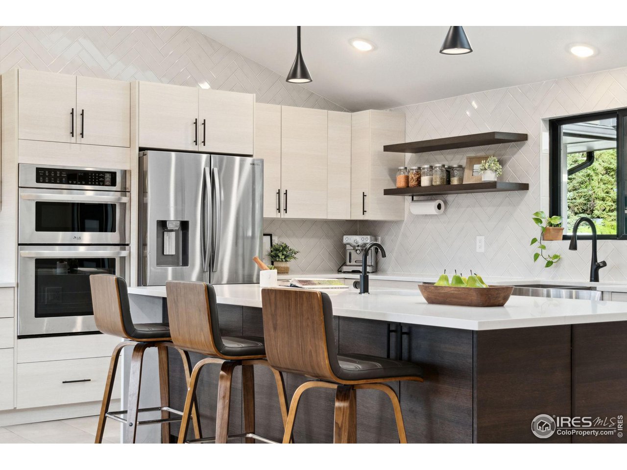 8861 Marathon Road Niwot, CO 80503 - Photo 10 of 40 a kitchen with stainless steel appliances granite countertop a sink a stove a refrigerator and a cabinets