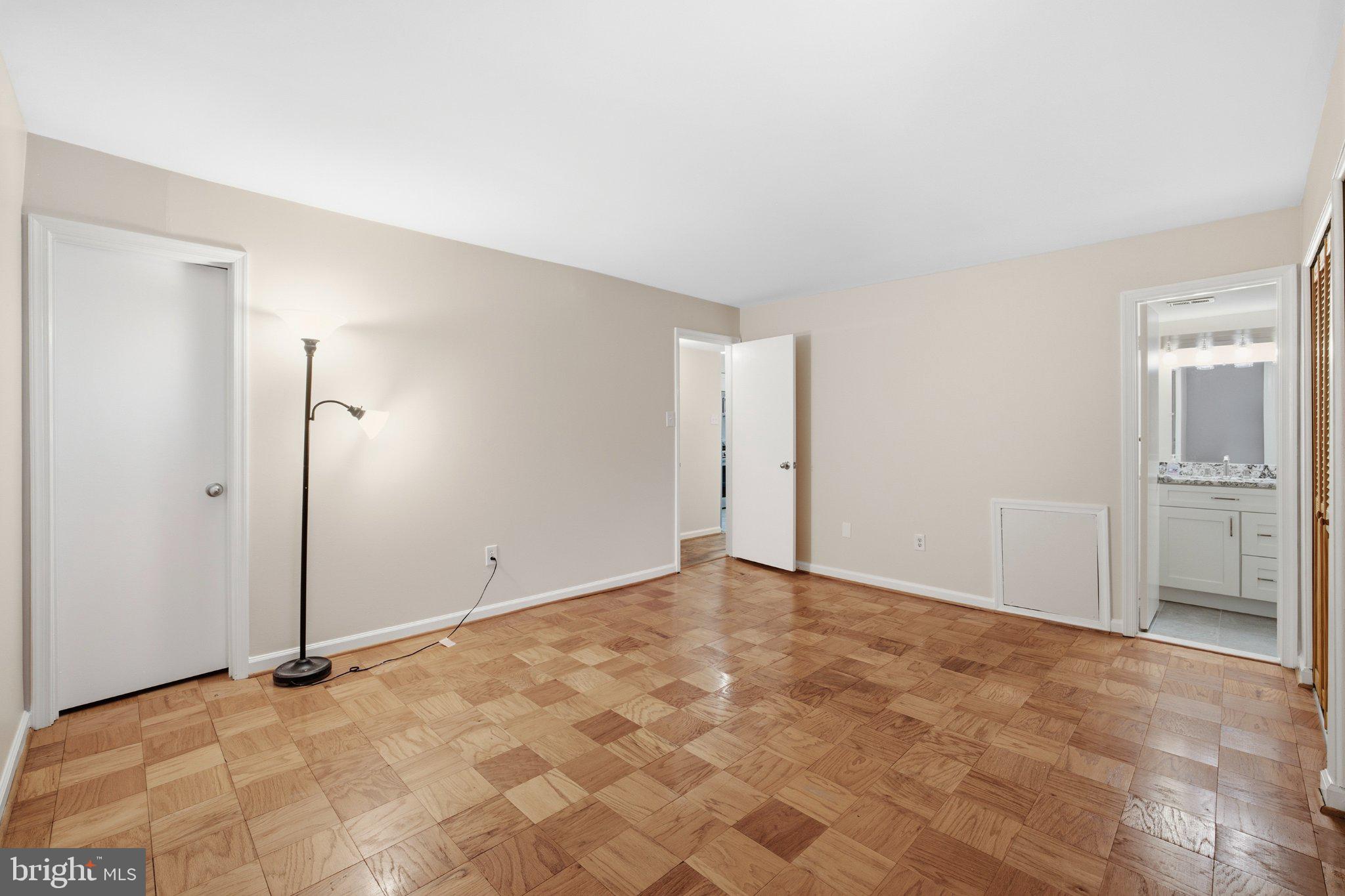 2005 Coleridge Drive, Unit 13101 Silver Spring, MD 20902 - Photo 9 of 16 Spacious room with warm wood floors.