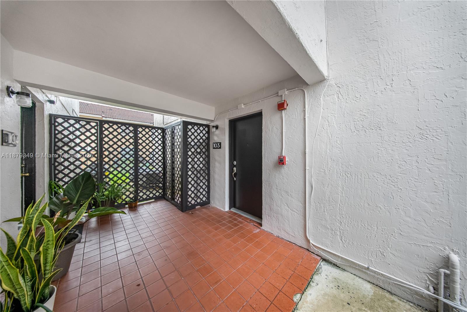 13045 Southwest 68th Street, Unit 103 Miami, FL 33183 - Photo 2 of 13 a view of a backyard