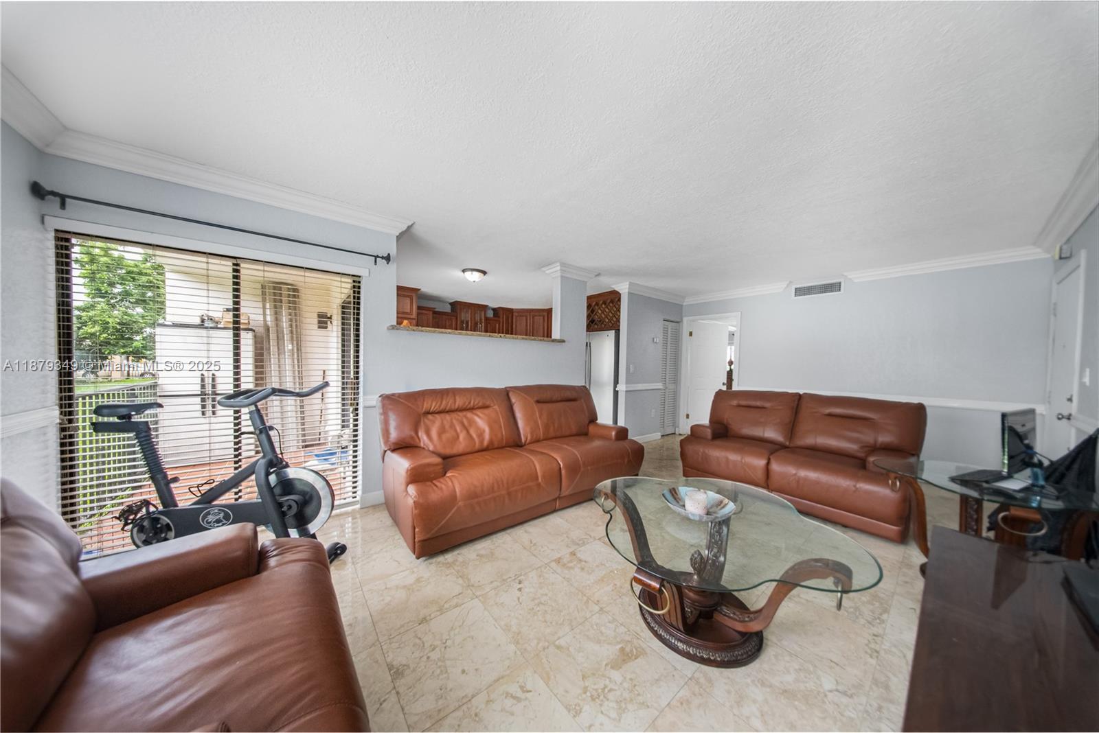 13045 Southwest 68th Street, Unit 103 Miami, FL 33183 - Photo 3 of 13 a living room with furniture a floor to ceiling window and floor to ceiling window