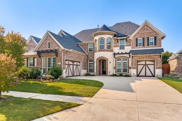 a view of house with yard and entertaining space