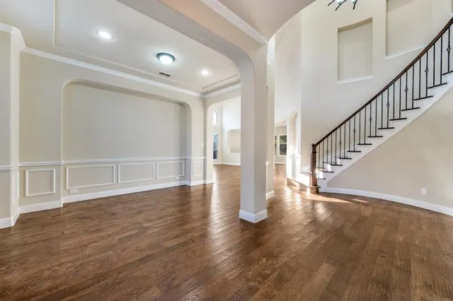 a view of an entryway with wooden floor