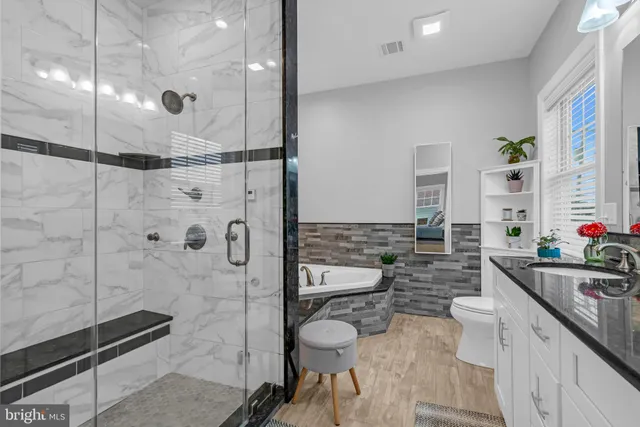 a bathroom with a toilet sink and shower