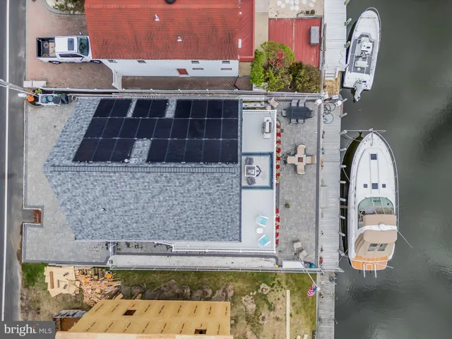 a front view of a house with large windows