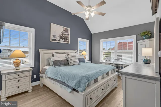 a bedroom with a bed and a dresser