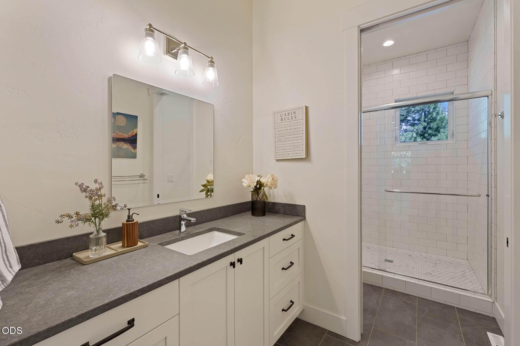 60255 Sunset View Drive Bend, OR 97702 - Photo 27 of 48 a bathroom with a sink and a mirror