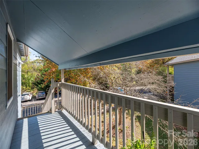 a view of balcony with wooden floor