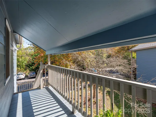 a view of balcony with wooden floor