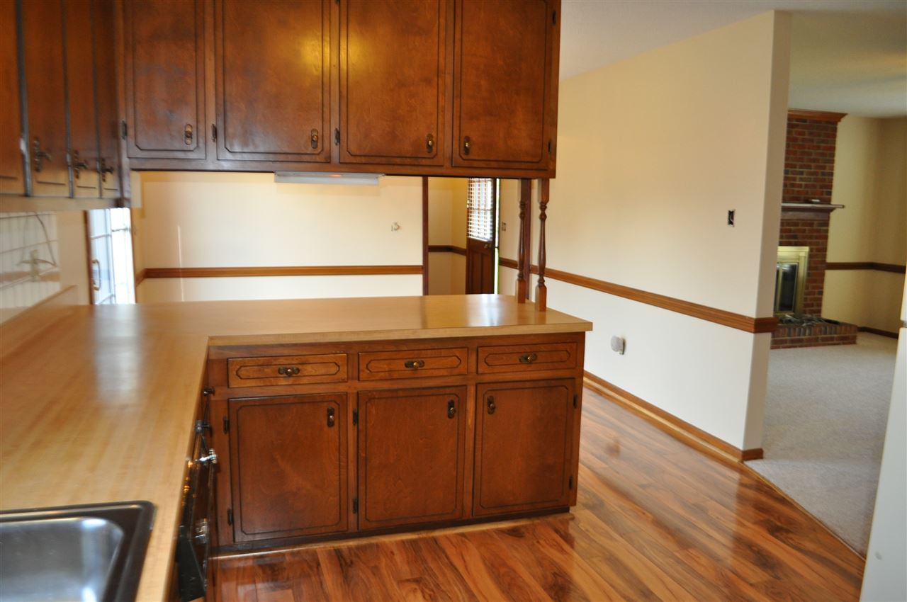 5616 Cleveland Road Clayton, NC 27520 - Photo 5 of 21 Lots of counter space. New laminate wood floor thru out kitchen, dining and laundry room.