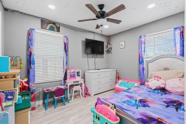 a room with furniture and a flat screen tv