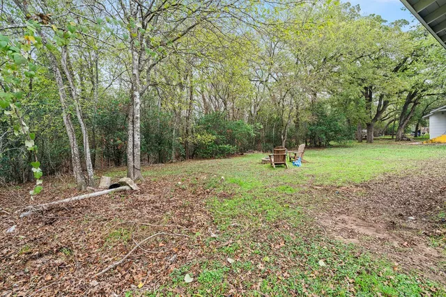 a backyard of a house with lots of green space