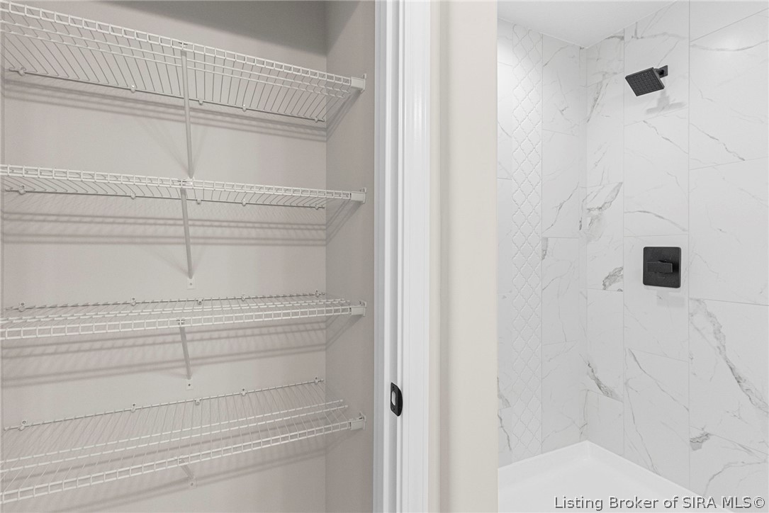 379 Garrison Street Hanover, IN 47243 - Photo 19 of 29 Linen closet and shower in Primary ensuite bathroom