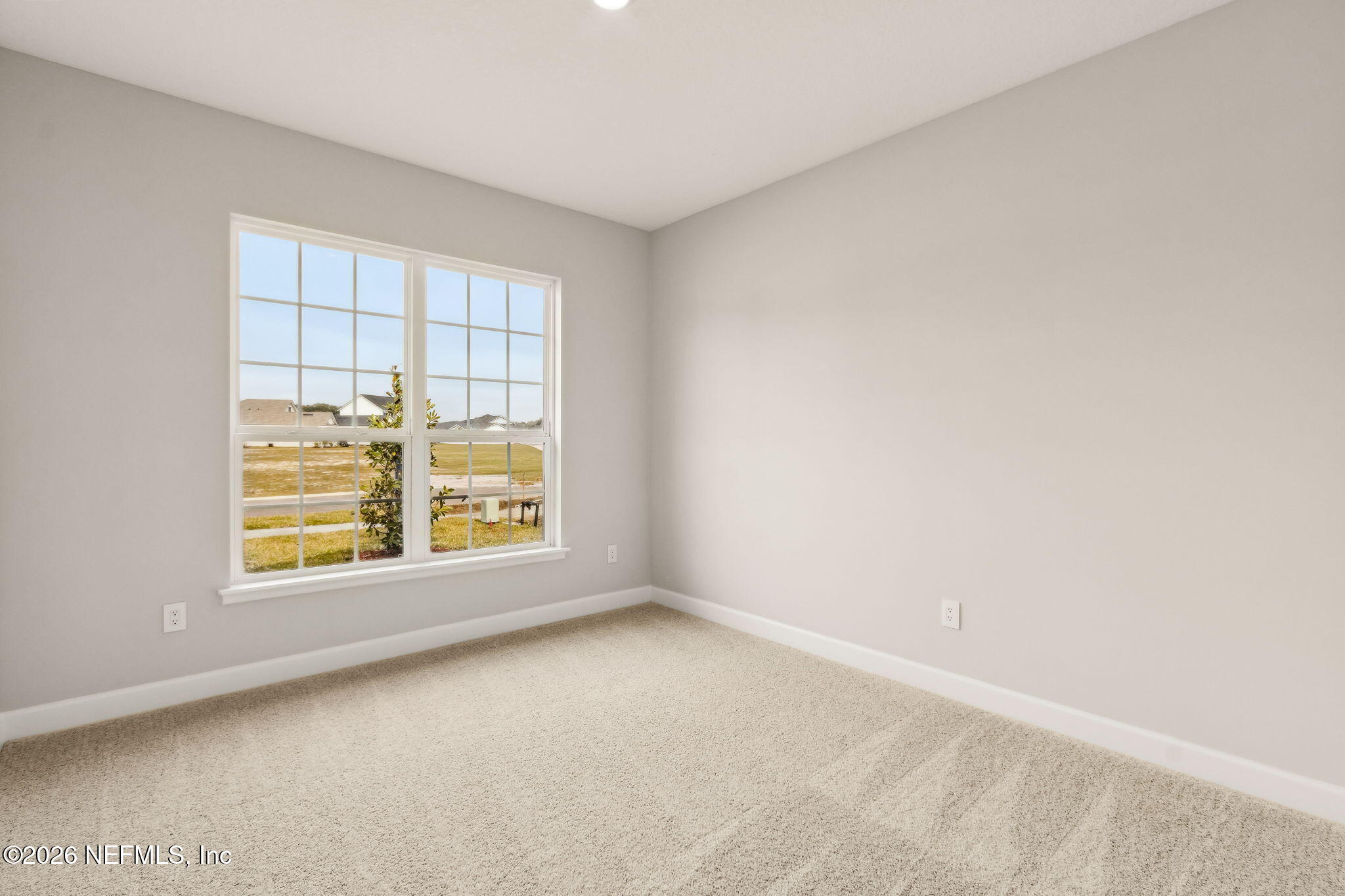 85236 Sandy Rdg Loop, Unit 26 Yulee, FL 32097 - Photo 11 of 17 an empty room with a window