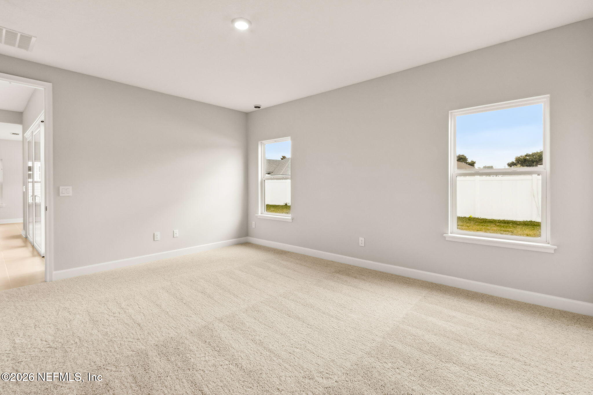 85236 Sandy Rdg Loop, Unit 26 Yulee, FL 32097 - Photo 7 of 17 a view of an empty room with a window