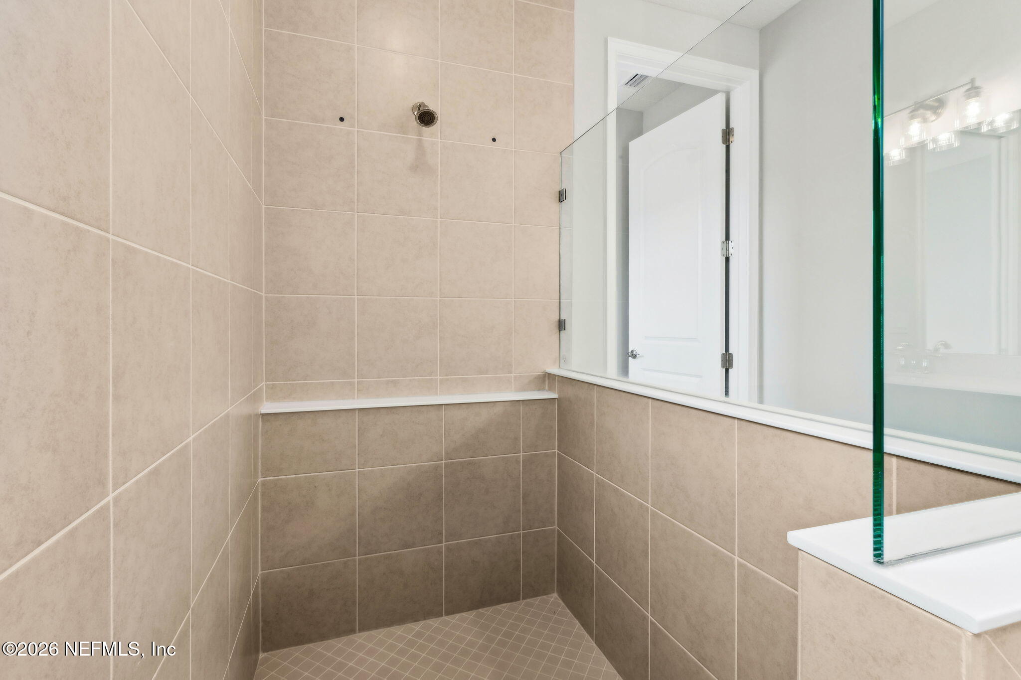 85236 Sandy Rdg Loop, Unit 26 Yulee, FL 32097 - Photo 9 of 17 a bathroom with a shower
