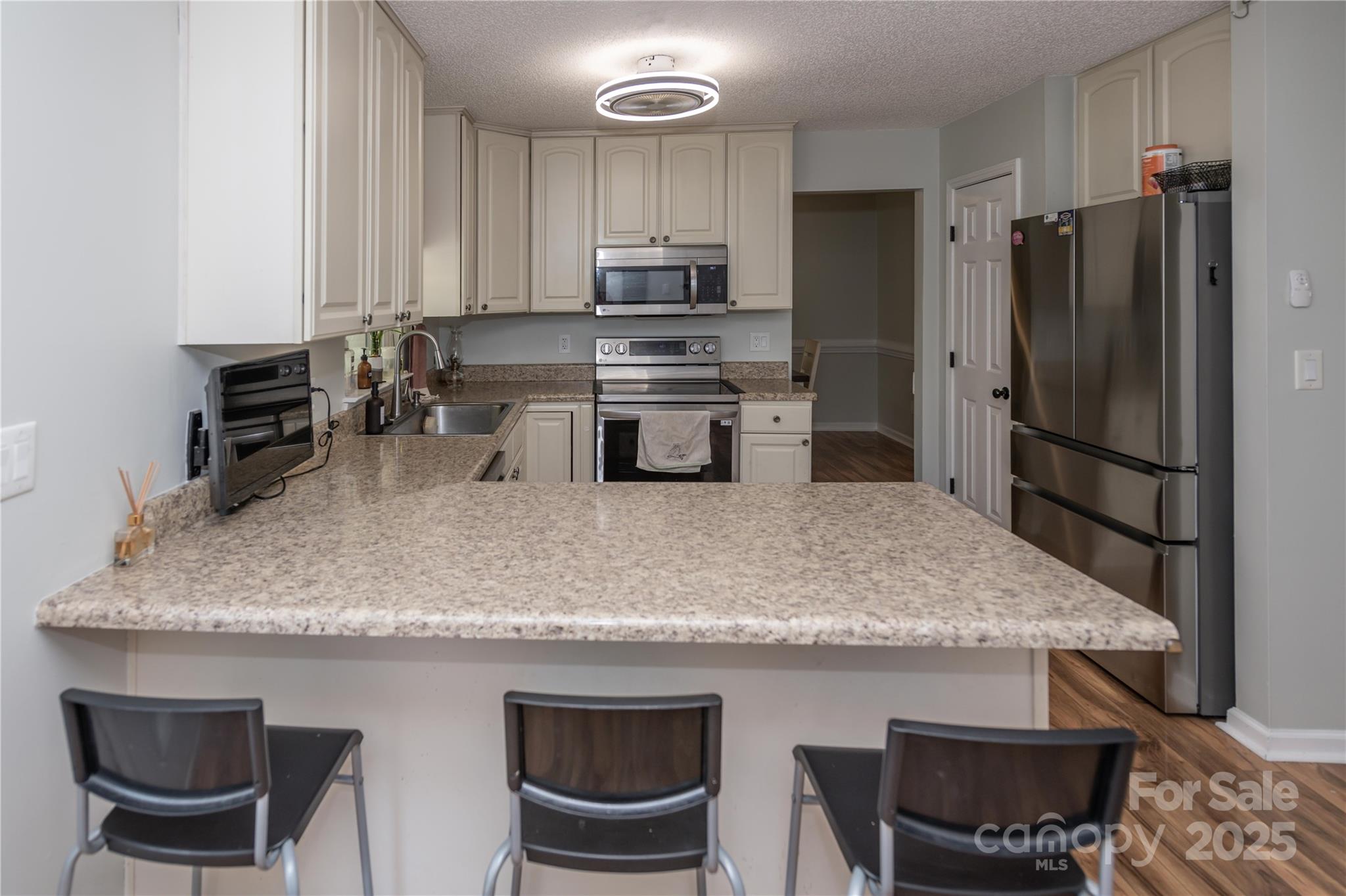 2085 Chapel Creek Road Concord, NC 28025 - Photo 12 of 47 a kitchen with a table and chairs