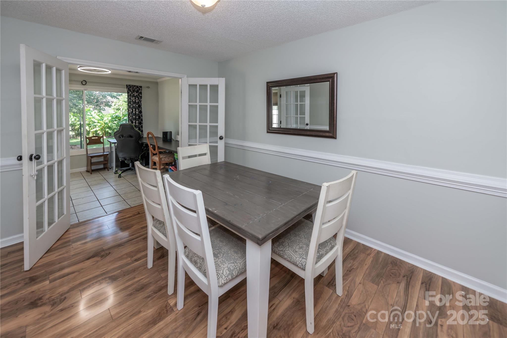 2085 Chapel Creek Road Concord, NC 28025 - Photo 20 of 47 a view of a dining room with furniture and wooden floor