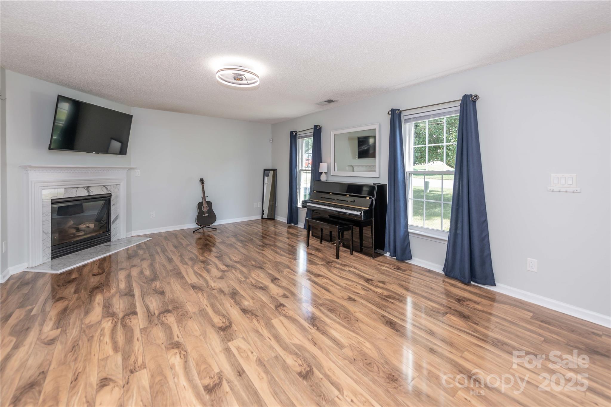 2085 Chapel Creek Road Concord, NC 28025 - Photo 2 of 47 a bedroom with a bed and a flat screen tv