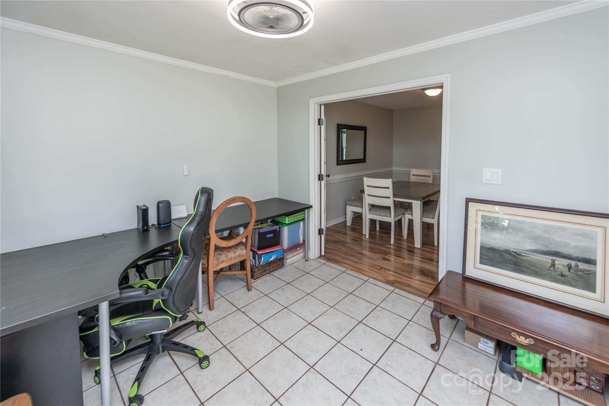 2085 Chapel Creek Road Concord, NC 28025 - Photo 25 of 47 a dining room with furniture and a wooden floor