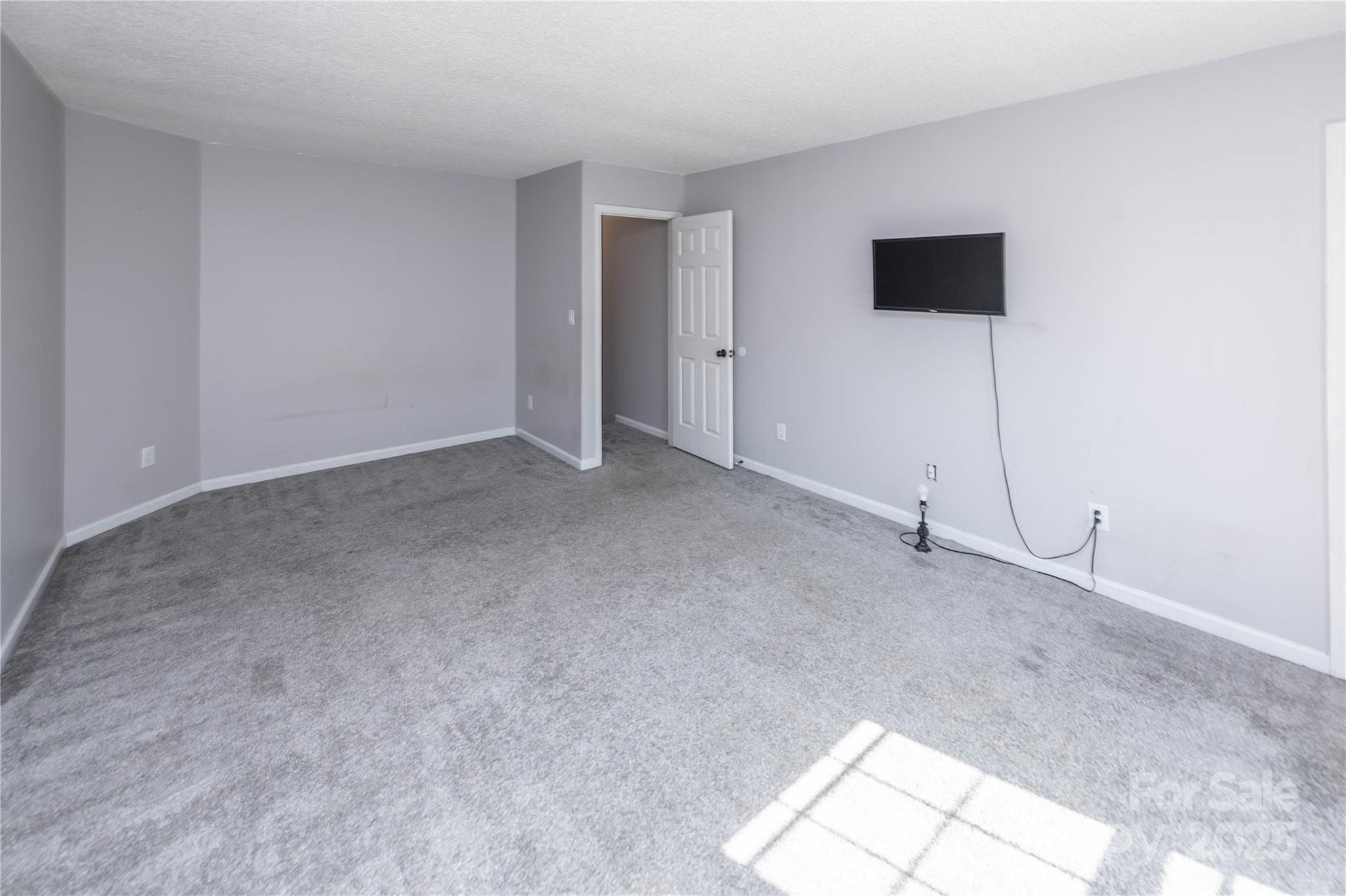2085 Chapel Creek Road Concord, NC 28025 - Photo 28 of 47 a view of an empty room with a window