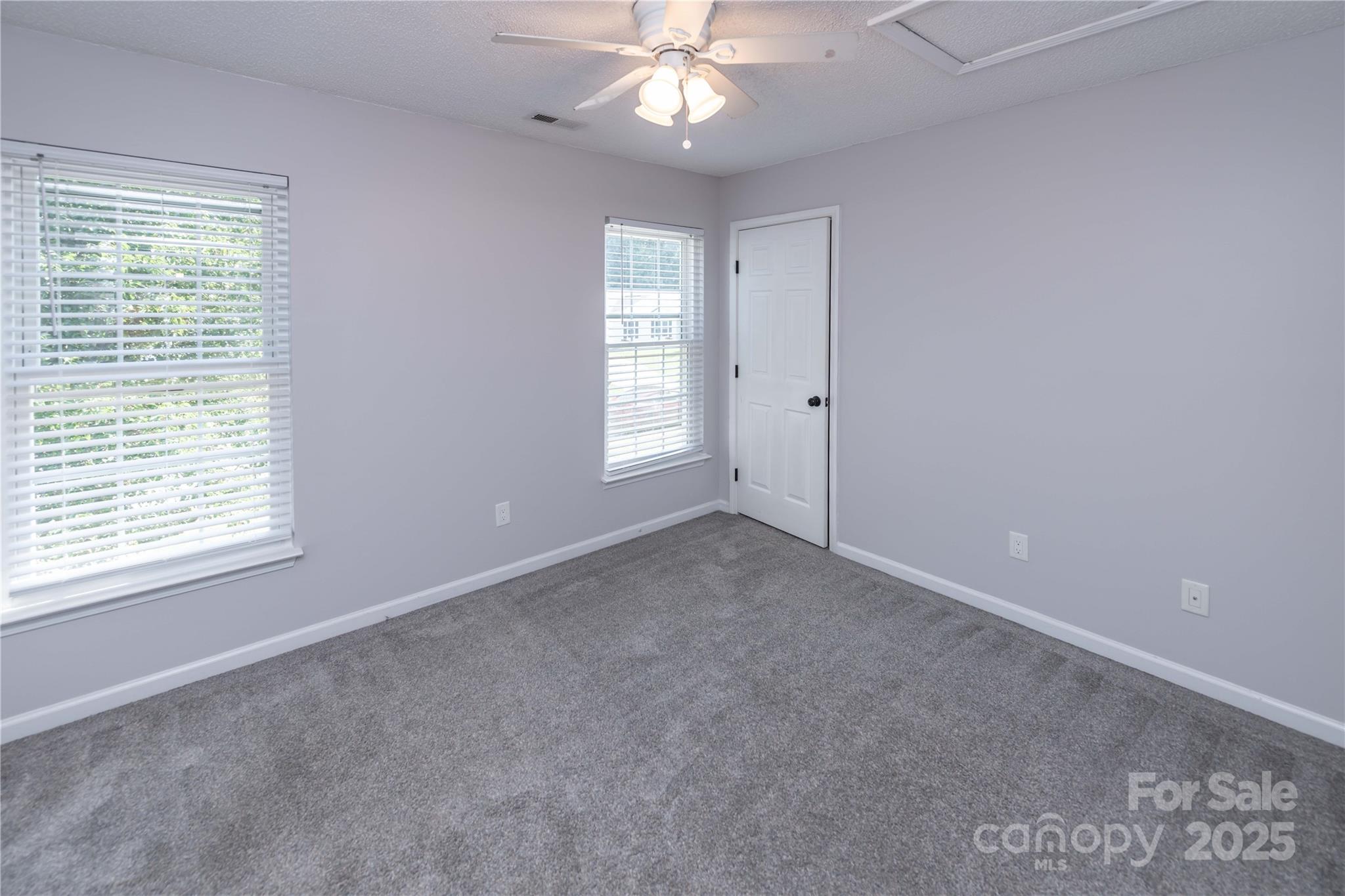 2085 Chapel Creek Road Concord, NC 28025 - Photo 29 of 47 a view of a livingroom with a ceiling fan and window