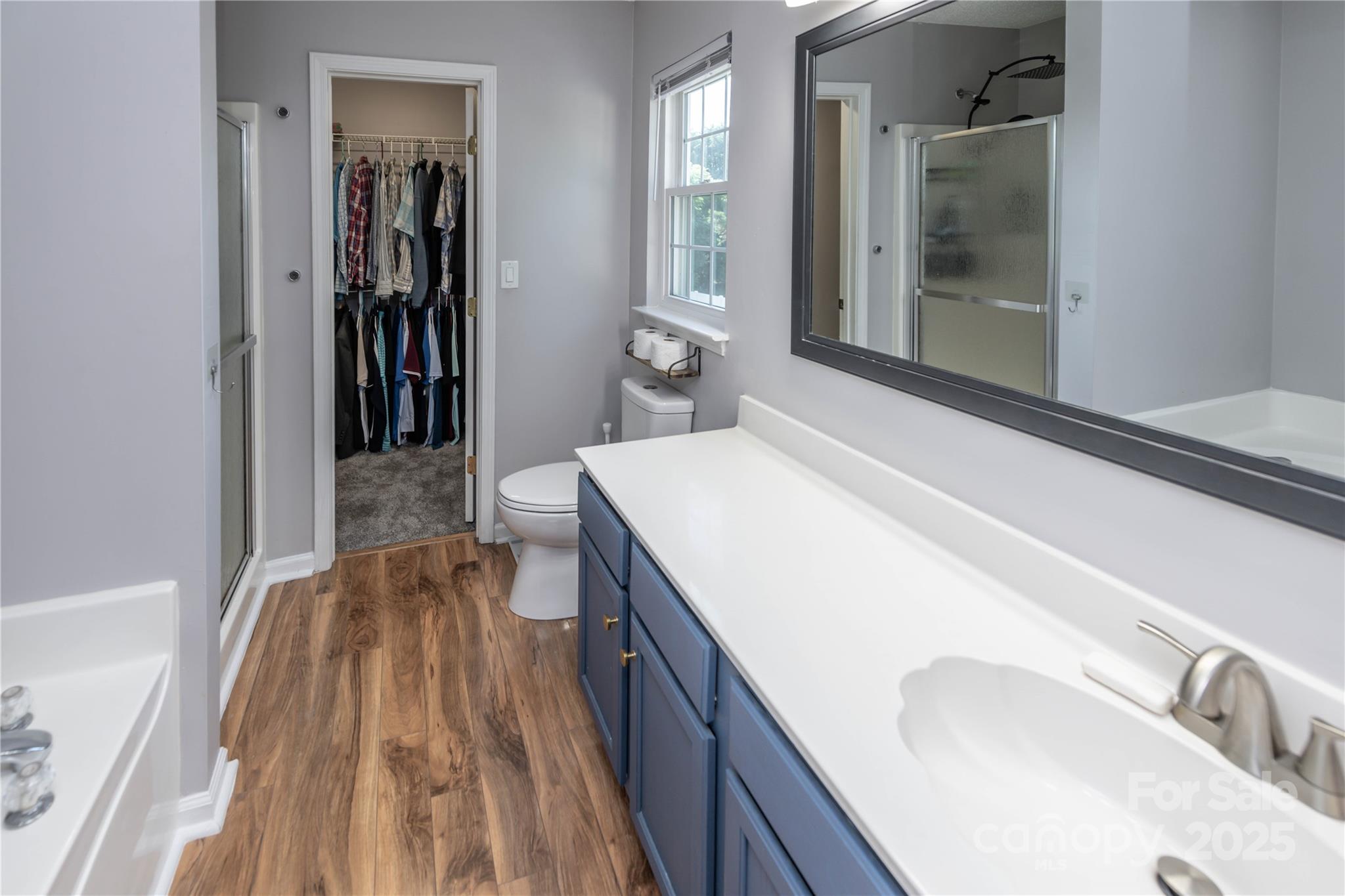 2085 Chapel Creek Road Concord, NC 28025 - Photo 33 of 47 a spacious bathroom with a sink and a mirror