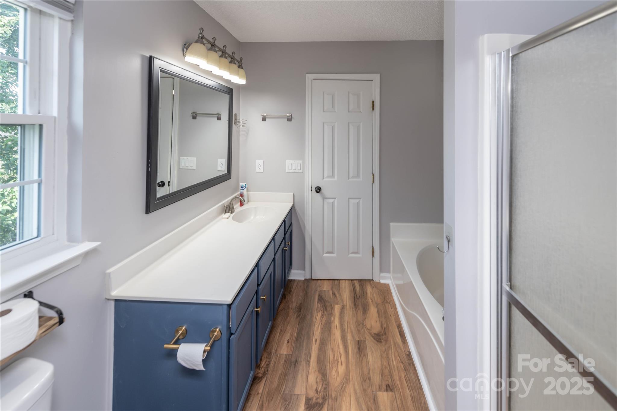 2085 Chapel Creek Road Concord, NC 28025 - Photo 35 of 47 a bathroom with a sink a mirror and a toilet