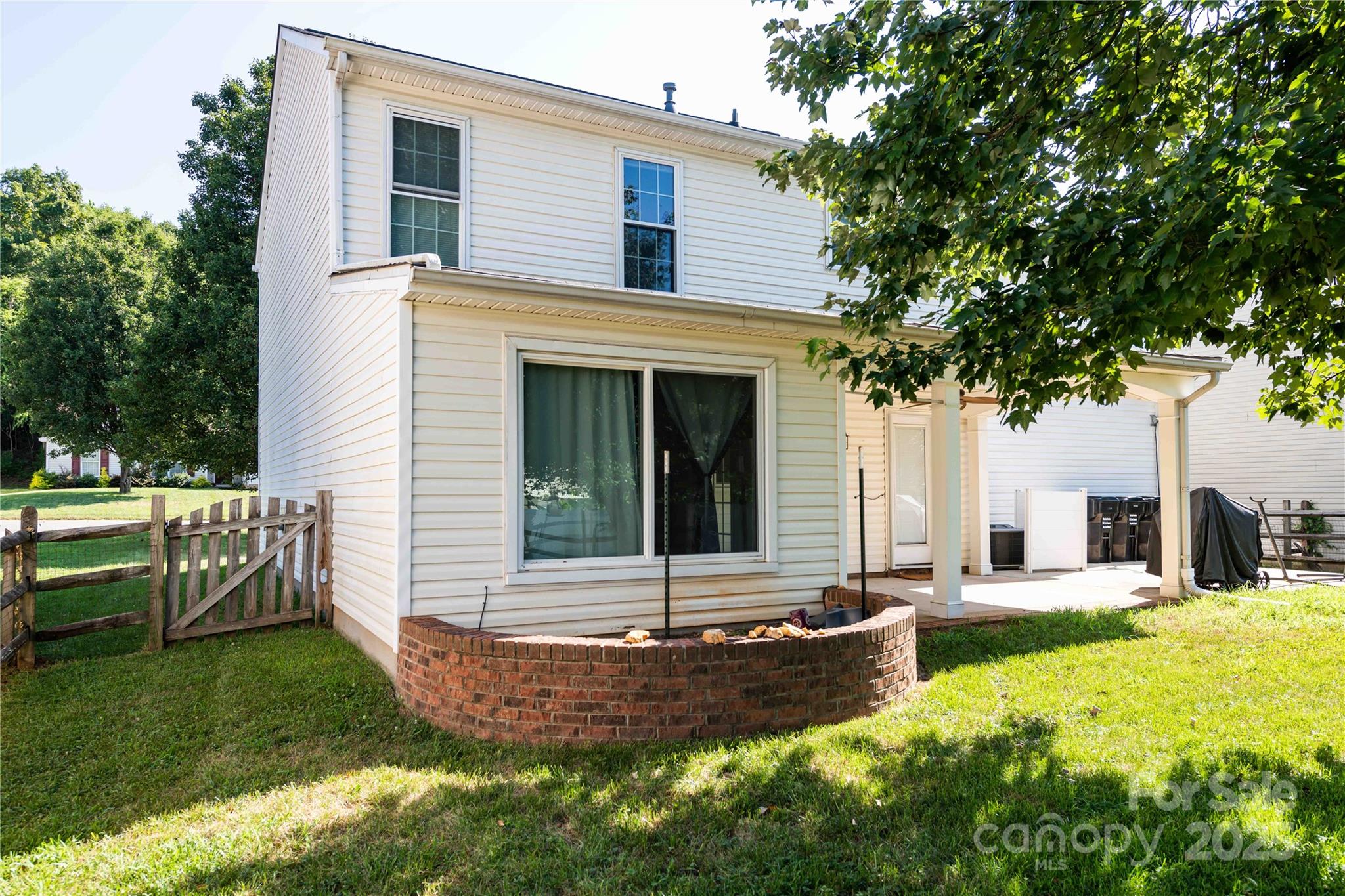2085 Chapel Creek Road Concord, NC 28025 - Photo 43 of 47 a view of house with yard outdoor seating and green space