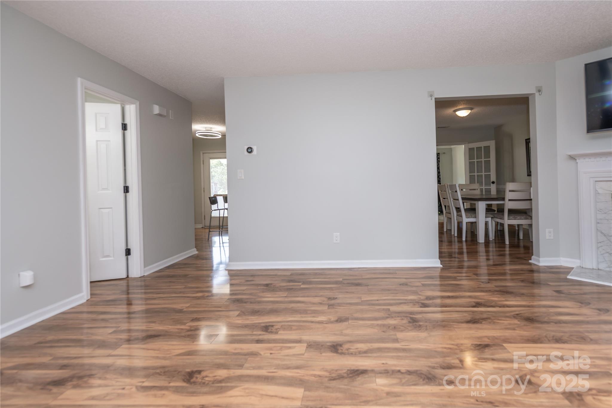 2085 Chapel Creek Road Concord, NC 28025 - Photo 7 of 47 a view of empty room with wooden floor