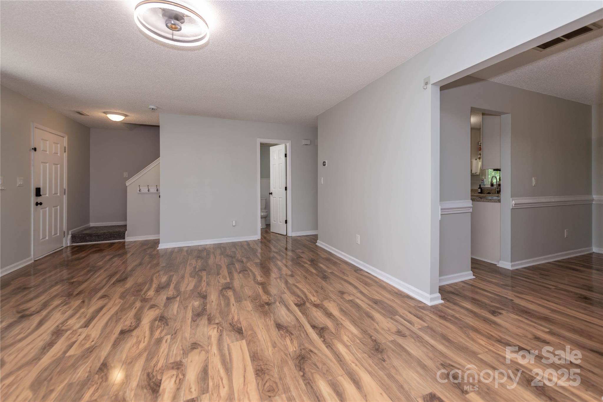 2085 Chapel Creek Road Concord, NC 28025 - Photo 8 of 47 a view of empty room with wooden floor