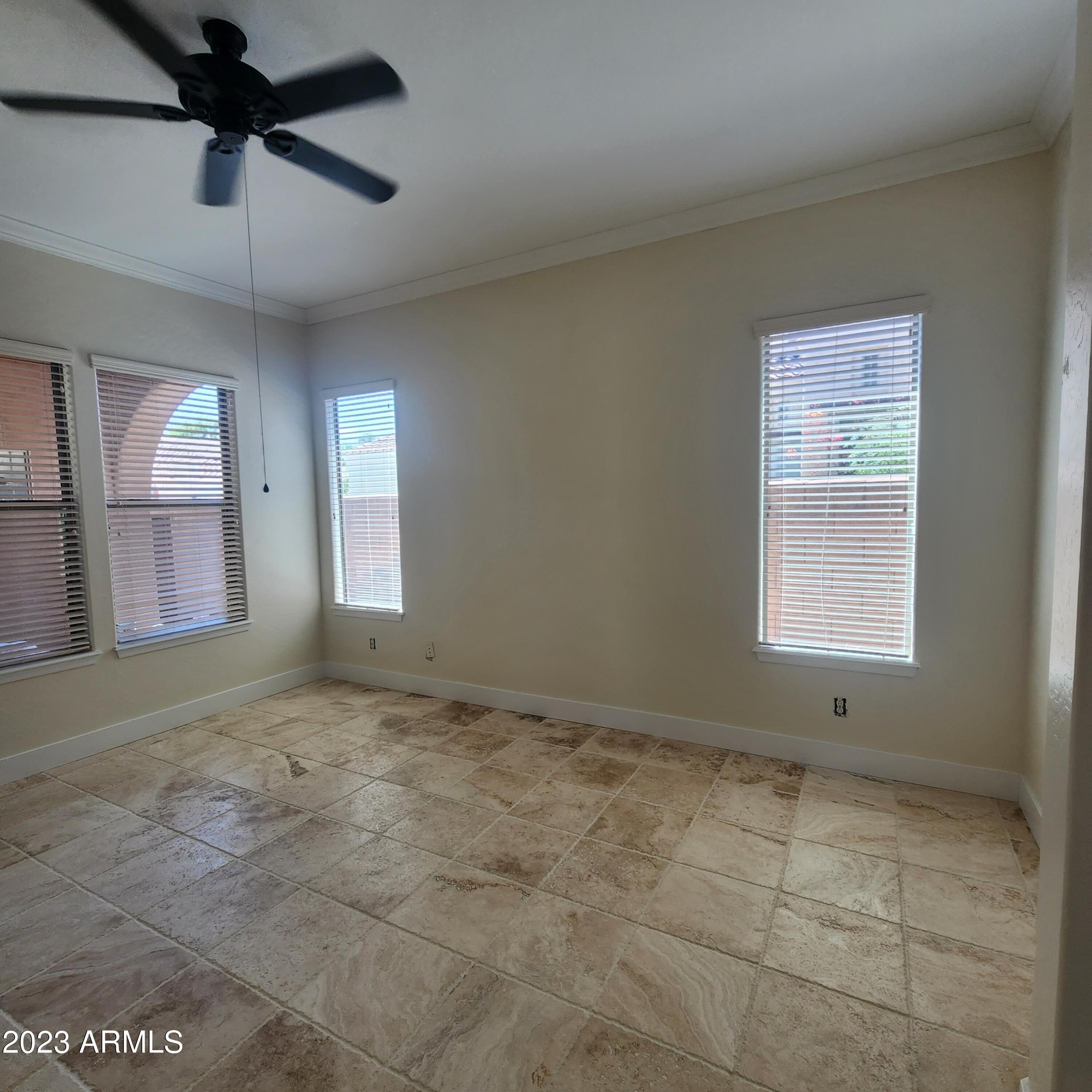 4553 North Point Ridge Road Buckeye, AZ 85396 - Photo 3 of 13 a view of an empty room and window