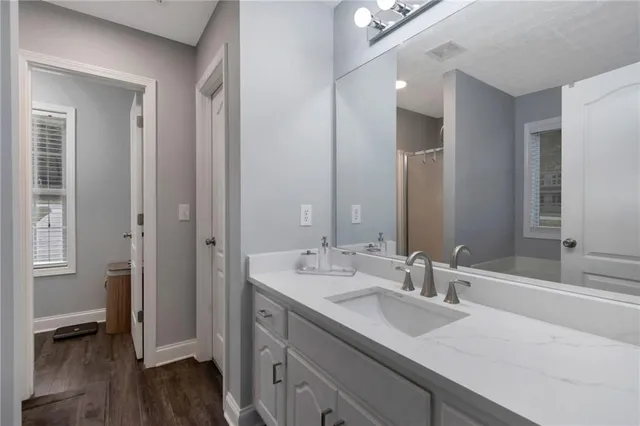 a bathroom with a sink and a mirror