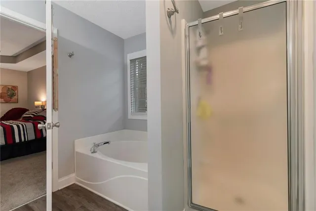 a bathroom with a bathtub and shower