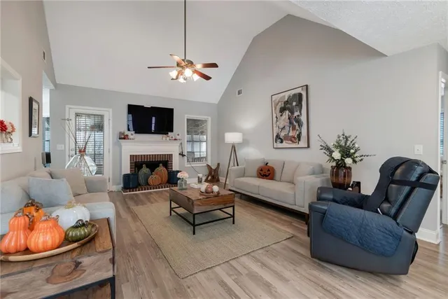 a living room with furniture fireplace and a flat screen tv