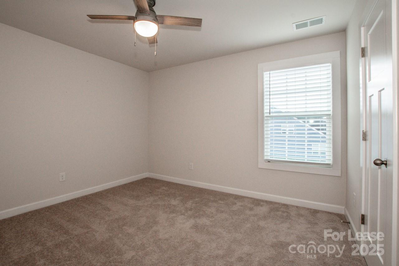 13218 Caite Ridge Road Davidson, NC 28036 - Photo 15 of 48 an empty room with a window