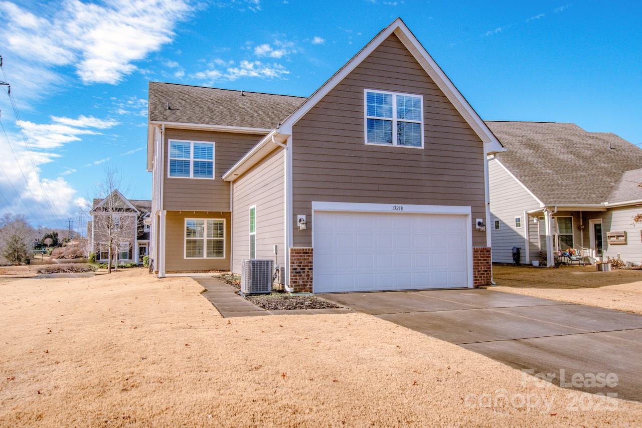 13218 Caite Ridge Road Davidson, NC 28036 - Photo 2 of 48 a front view of a house with a yard