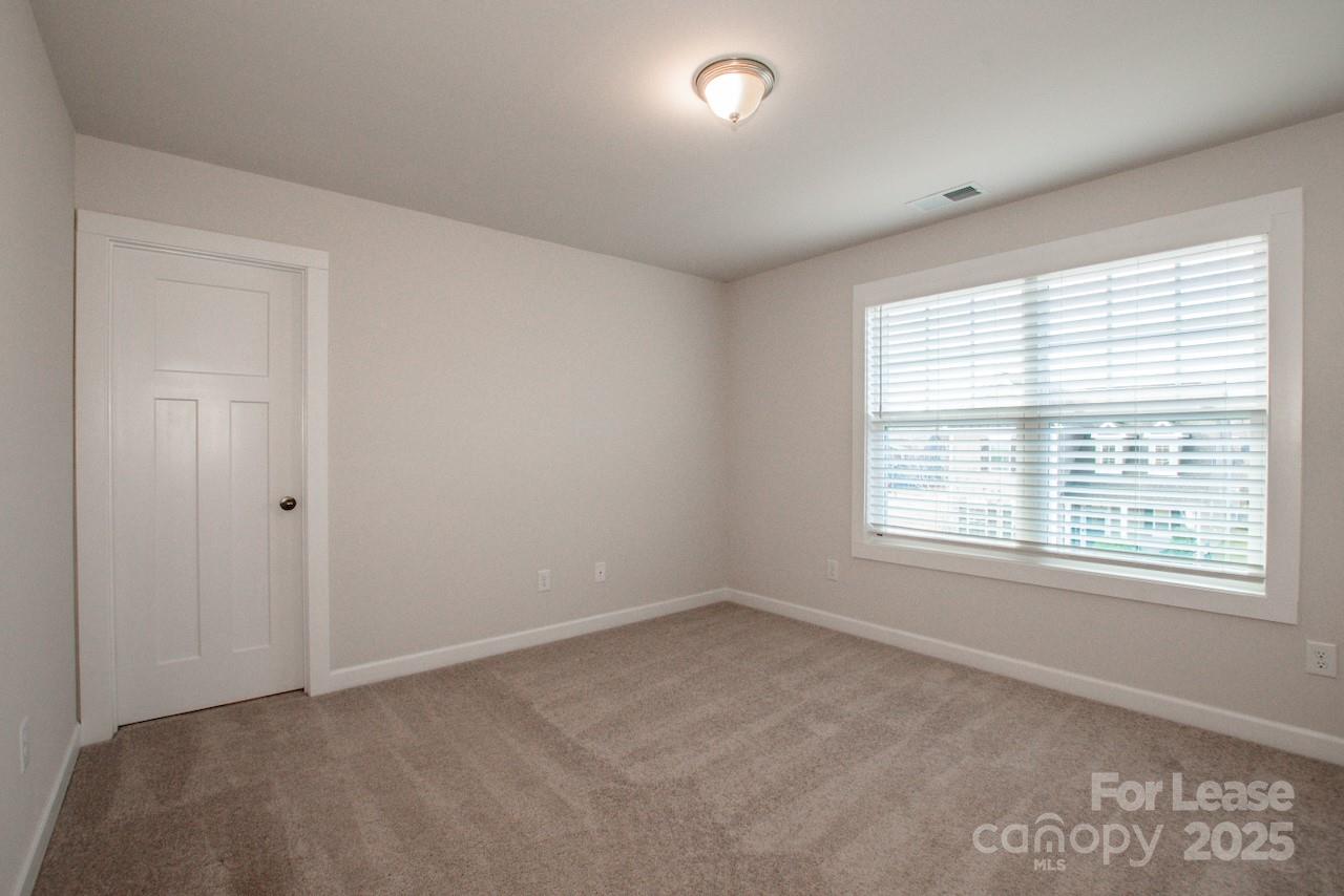 13218 Caite Ridge Road Davidson, NC 28036 - Photo 24 of 48 an empty room with a window