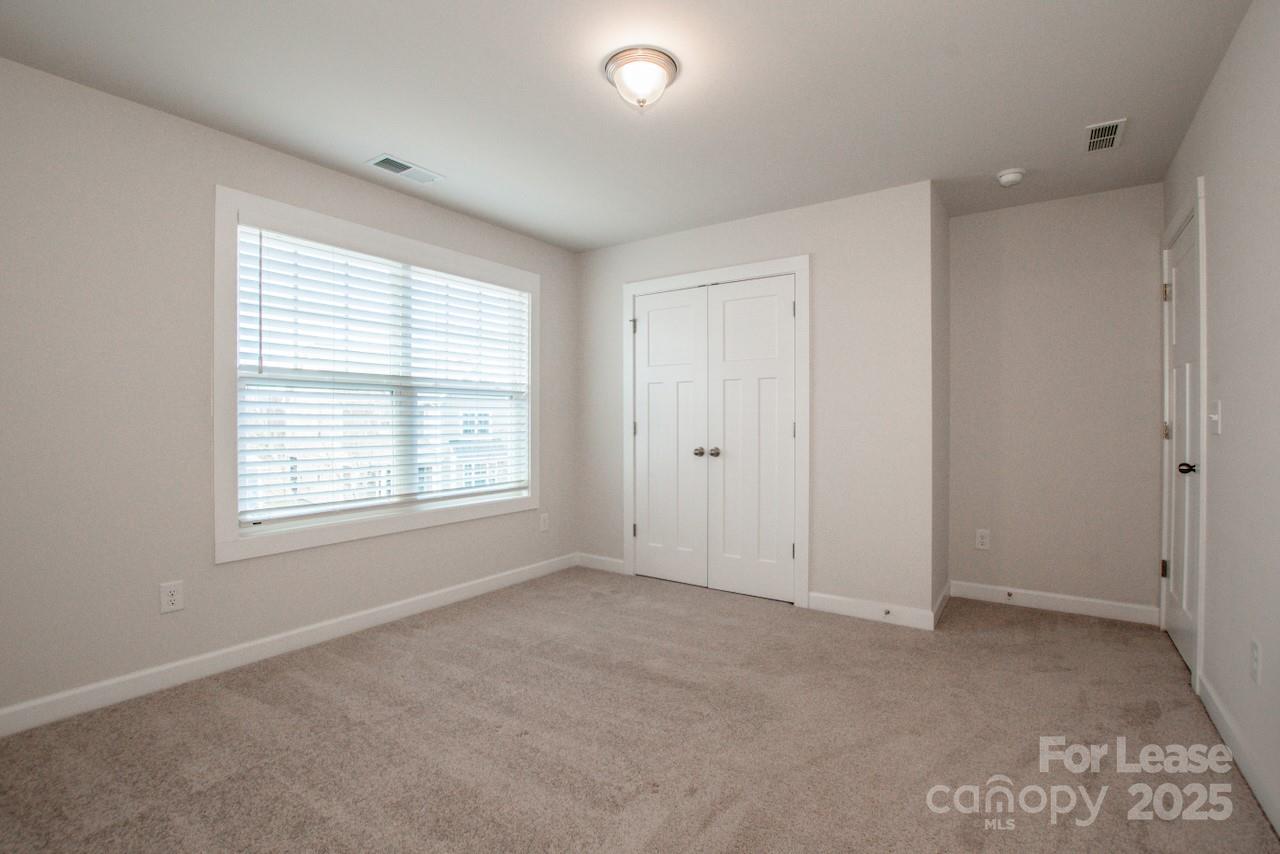 13218 Caite Ridge Road Davidson, NC 28036 - Photo 33 of 48 a view of an empty room with a window