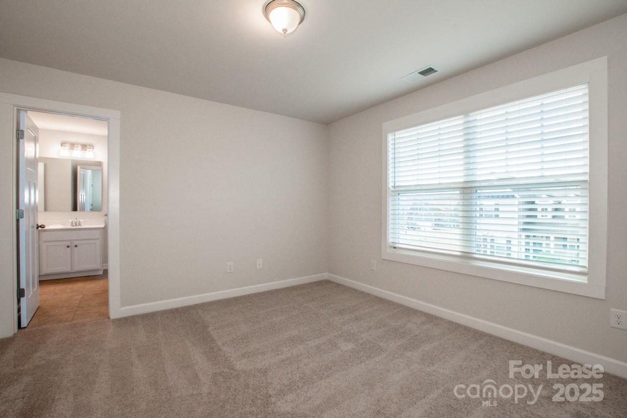 13218 Caite Ridge Road Davidson, NC 28036 - Photo 39 of 48 a view of an empty room with a window