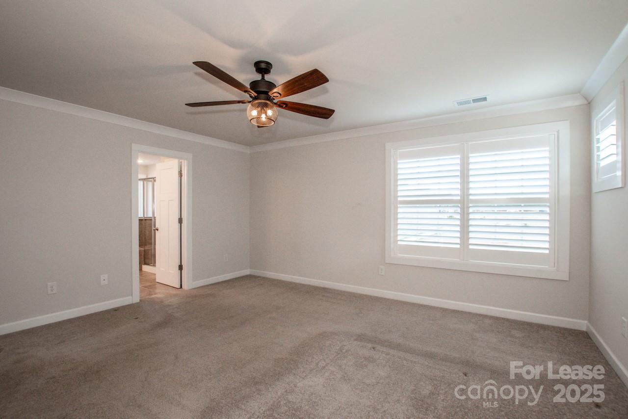 13218 Caite Ridge Road Davidson, NC 28036 - Photo 40 of 48 a view of an empty room with a window