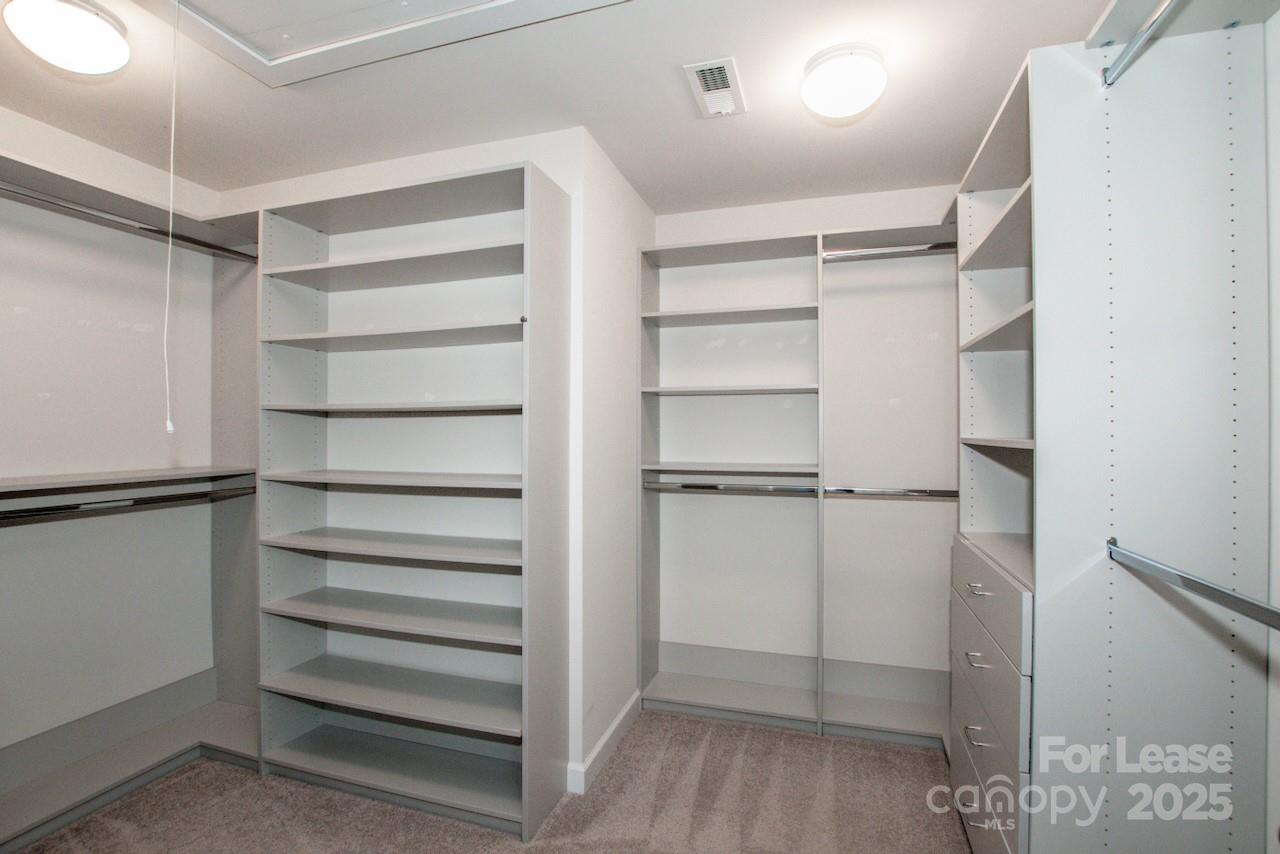 13218 Caite Ridge Road Davidson, NC 28036 - Photo 44 of 48 a view of walk in closet with empty racks